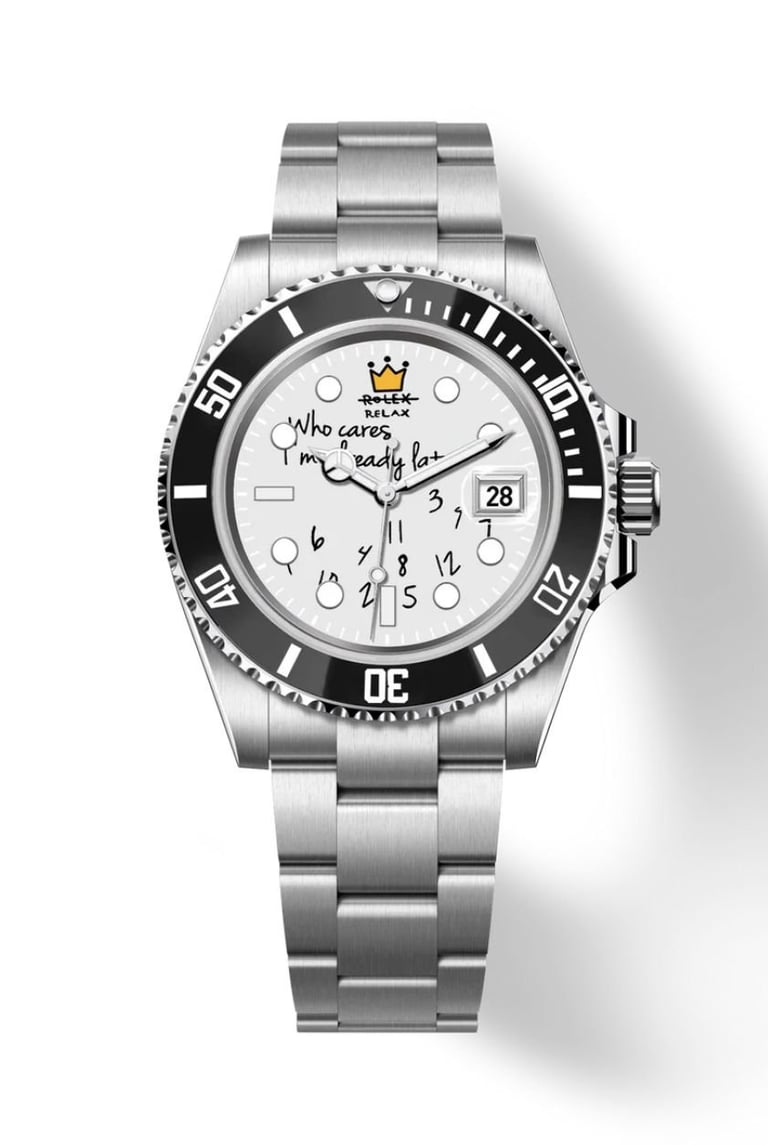 Stainless steel luxury watch with black bezel, white dial featuring handwritten text and numbers, and date window